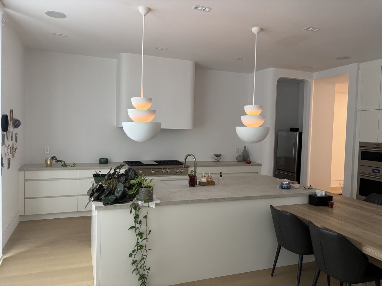 Gourmet kitchen with custom cabinetry, large island, and premium quartz countertops