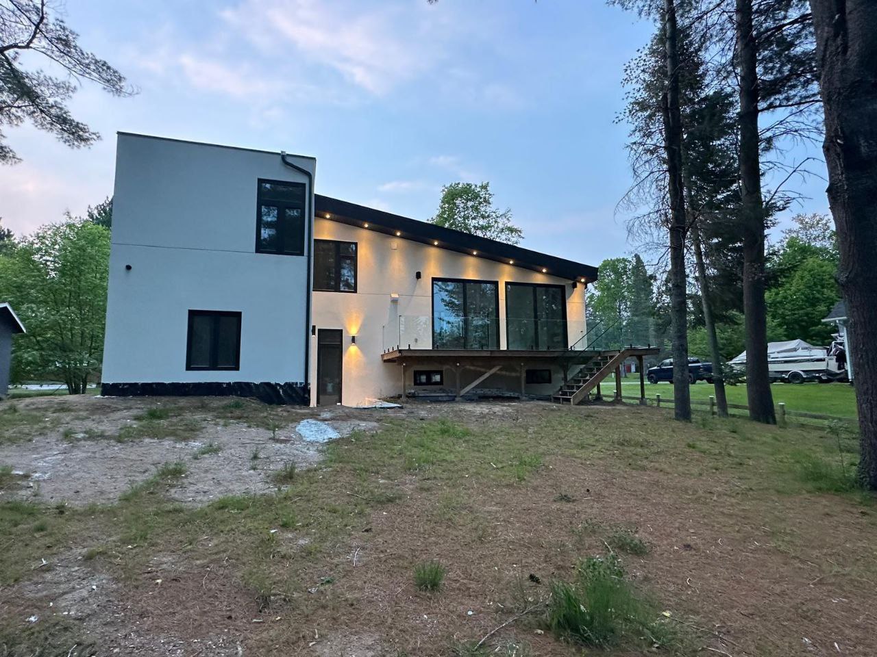 Open-concept living area with 16-foot ceilings and expansive 10-foot windows